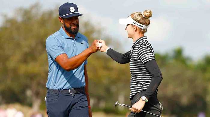 Tony Finau and Nelly Korda bump fists on the ninth green during the first round of the Grant Thornton Invitational at Tiburon Golf Club on Dec. 8, 2023 in Naples, Fla.